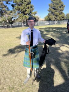 Band member with drum major mace