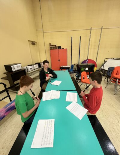 Beginner bagpipe students learning fingering techniques