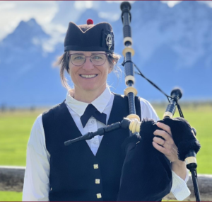 Bagpiper with Teton Mountain range in background