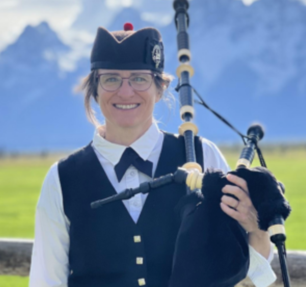 Bagpiper with Teton Mountain range in background